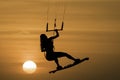 Kitesurfing girl silhouette jumping at golden hour sunset kiteboarding jump Royalty Free Stock Photo