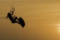 Kitesurfing girl silhouette jumping at golden hour sunset woman kiteboarding jump Royalty Free Stock Photo