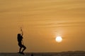 Kitesurfing girl silhouette jumping at golden hour sunset woman kiteboarding jump Royalty Free Stock Photo