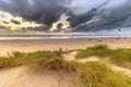 Kitesurfing seen from the dunes at sunset Royalty Free Stock Photo