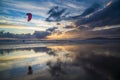 Kitesurfing at sunset on the beach,