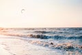 Kitesurfing at sunset: male surfer silhouette at sea Royalty Free Stock Photo