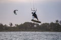 kitesurfing. A surfer doing all kinds of stunts at sunset. International Kitesurfing Exhibition 2023