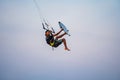 kitesurfing. A surfer doing all kinds of stunts at sunset. International Kitesurfing Exhibition 2023