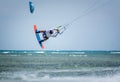 Kiteboarder kitesurfer man athlete jumping, kitesurfing kiteboarding jump