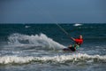 Kitesurfing on the waves of the sea in Mui Ne beach, Phan Thiet, Binh Thuan, Vietnam. Royalty Free Stock Photo