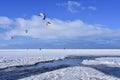 Kitesurfing in winter on ice. The Vistula Lagoon in Poland, a beautiful landscape Royalty Free Stock Photo