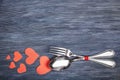 Kithcen cutlery and decorative paper hearts, on