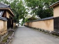 Pedestrian alley with plaster walls in historic samurai district of Kitsuki, Oita prefecture