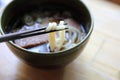 Kitsune udon noodles with fish ball and tofu on wood background japanese food Royalty Free Stock Photo