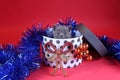 Kitten as Christmas gift in a present box, red background Royalty Free Stock Photo