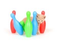 Kitten knocking over bowling pins Royalty Free Stock Photo