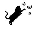 A kitten is playing with a butterfly. A wall sticker with the image