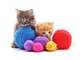 Kittens with balls of yarn