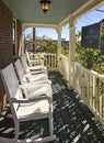 Rocking Chairs on Covered Front Porch of Old Victorian Home Royalty Free Stock Photo