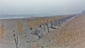 Kitty Hawk Beach Barrier Fence in Fog Royalty Free Stock Photo