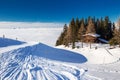 KITZBUEHEL, AUSTRIA - February 18, 2016 - Alpine chalet covered by snow in Kitzbuehel ski arena, Austria