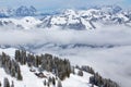 KITZBUEHEL, AUSTRIA - February 18, 2016 - Skier skiing and enjoying the view to Alpine mountains in Austria