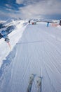 KITZBUEHEL, AUSTRIA - February 17, 2016 - Skiers skiing in Kitzbuehel ski resort and enjoying Alps view from the top