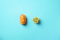 Kiwano or african horned melon on blue background. Top view. Cutted hedged gourd, african horned cucumber, english tomato. Exotic