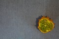 Kiwano slice on grey textile