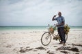 Seller of coconuts on a bicycle, Zanzibar