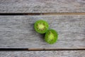 Kiwi berries (arctic kiwifruit) on wooden table