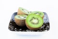 Kiwi on a black and white plate Royalty Free Stock Photo