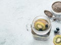 Kiwi and blueberry chia water in mason jar