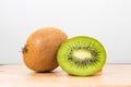 Kiwi on cutting board with white background