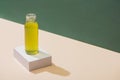 Kiwi fresh juice on white cube on green and white background