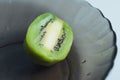 KIWI fruit on black plate, sliced ,