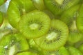 Kiwi fruit close-up in liquid with bubbles. Slices of gren ripe kiwi fruit in water. Close-up fresh slices of green kiwi Royalty Free Stock Photo