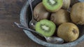 Kiwi fruit on wooden surface