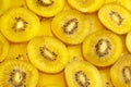 Kiwi Gold fruit background. Yellow kiwi slices with black seeds, closeup Royalty Free Stock Photo