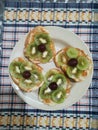 Kiwi and grape toppes of the morning sandwiches