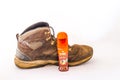 KIWI instant shoe polish and an old boot isolated Royalty Free Stock Photo