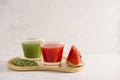 Kiwi juice and watermelon with fruit Slices on wooden tray Royalty Free Stock Photo