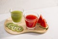 Kiwi juice and watermelon with fruit Slices on wooden tray Royalty Free Stock Photo