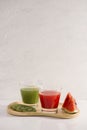 Kiwi juice and watermelon with fruit Slices on wooden tray Royalty Free Stock Photo