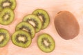 Kiwi lies on a wooden background