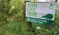 Kiwi live here sign in public park in Northland New Zealand