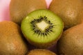 Kiwi macro, whole kiwi and fruit cut in half close-up
