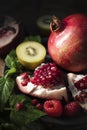 Kiwi, raspberries and pomegranate. Fruits source of vitamin C. Perfect snack or snack for any time Royalty Free Stock Photo