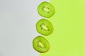 Kiwi slice on a blue and green background. copyspace for text Royalty Free Stock Photo