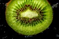 Kiwi slice splash Royalty Free Stock Photo