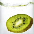 Kiwi slice splash in water Royalty Free Stock Photo