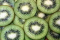 Kiwi sliced in circles lies on a flat surface texture