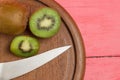 kiwi. sliced. half. fresh. cutting board with knife. on old woo Royalty Free Stock Photo