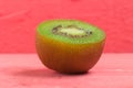 kiwi. sliced. half. fresh. fruit on old wood pink Royalty Free Stock Photo